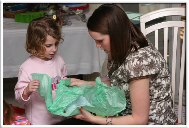 Will's cousin Ashlynn helped Will's Mommy open the gifts.
